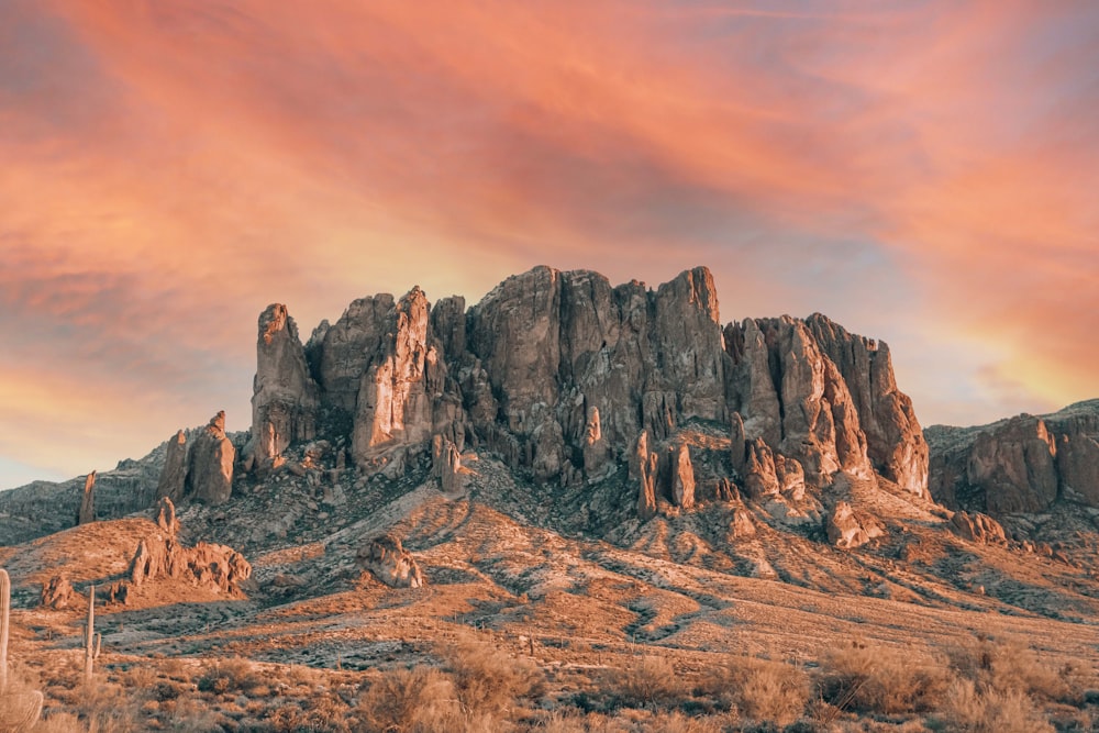 a mountain range with a sunset in the background