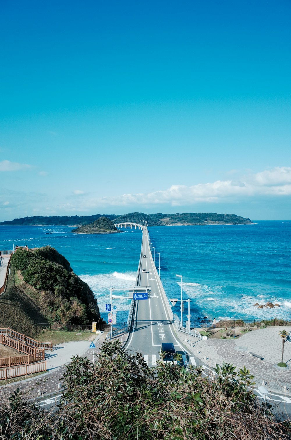 a view of the ocean from the top of a hill