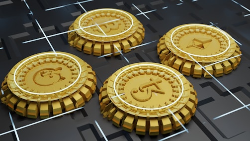 Four golden coins with different cryptocurrency logos are positioned in a grid-like arrangement on a dark, futuristic surface with intersecting white lines.