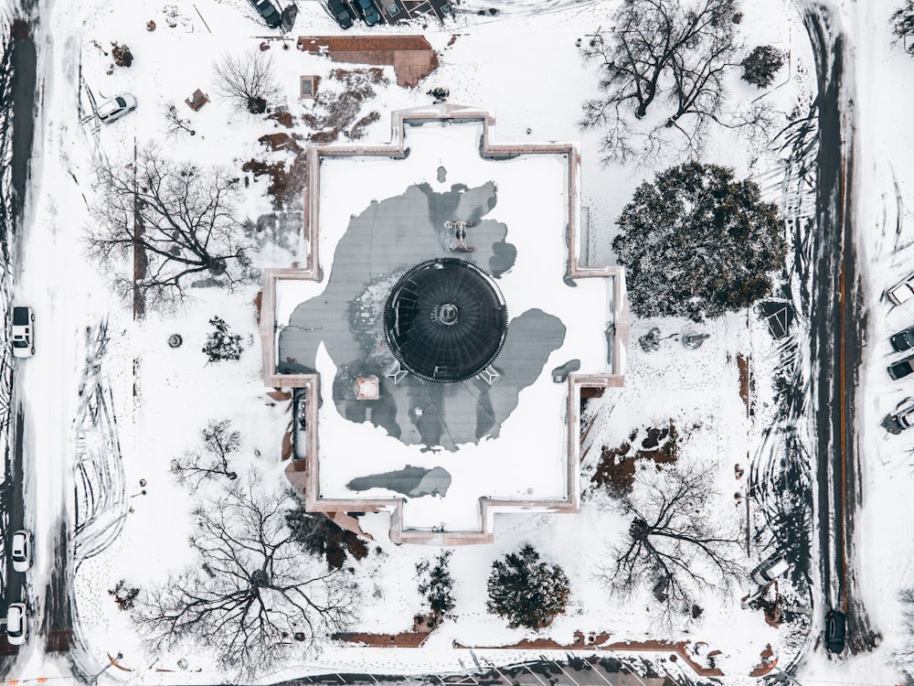 an aerial view of a snow covered park