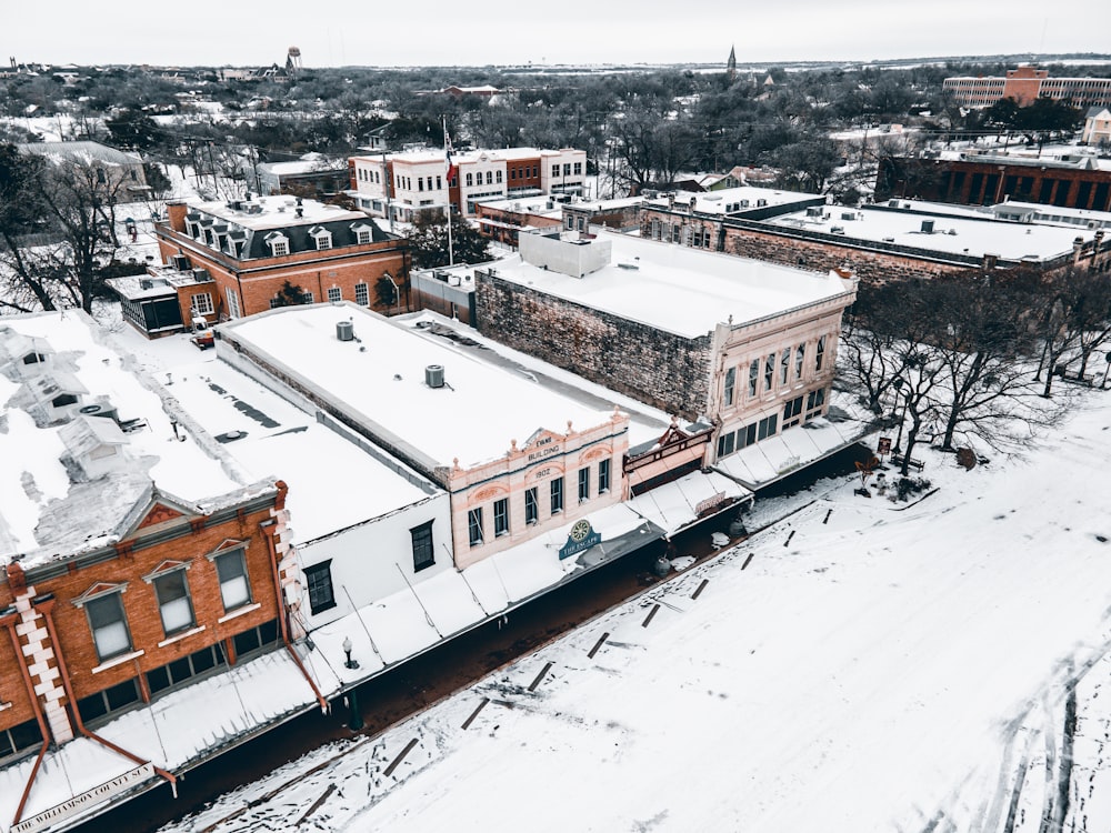 an aerial view of a snow covered city