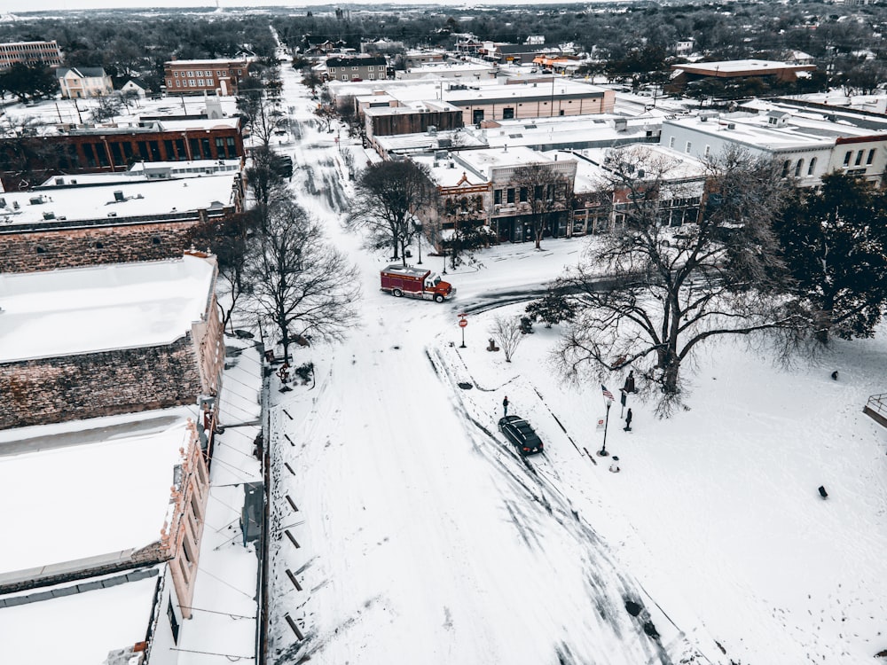 an aerial view of a snowy city street
