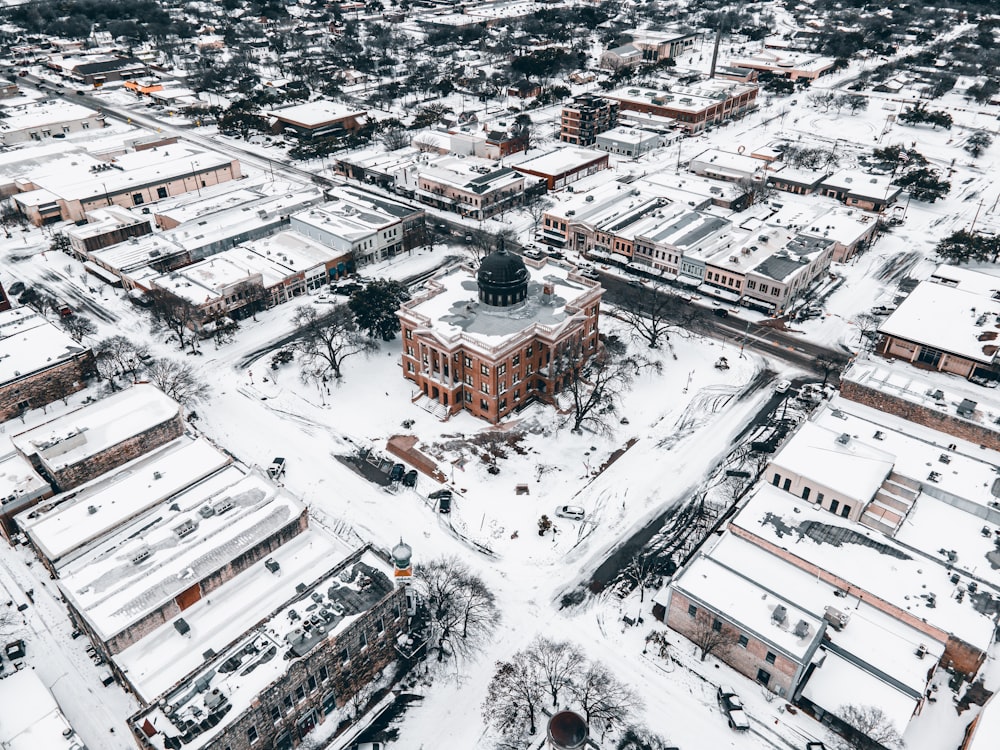 an aerial view of a snow covered city