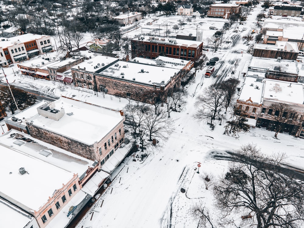 an aerial view of a snow covered city