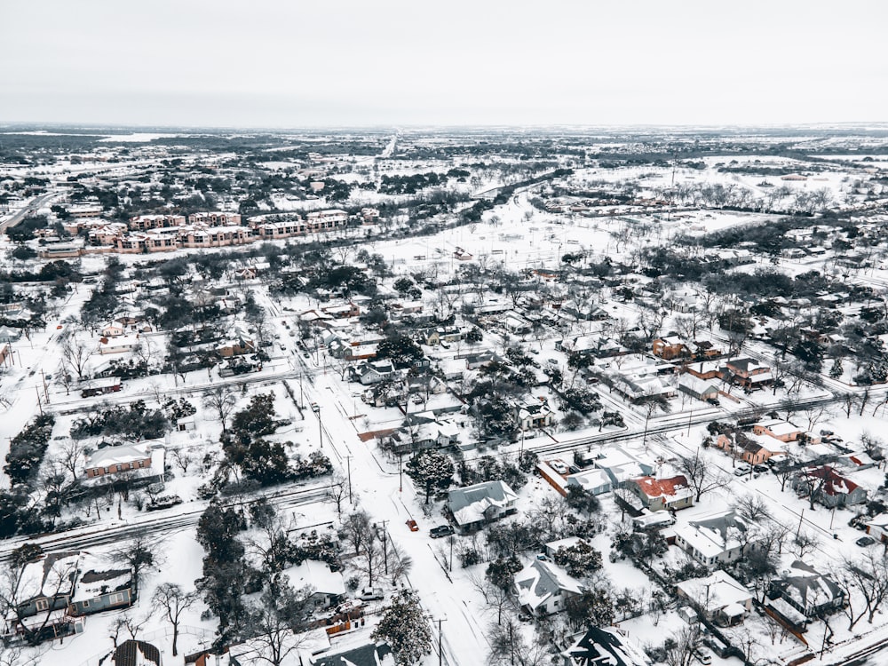 an aerial view of a snow covered neighborhood