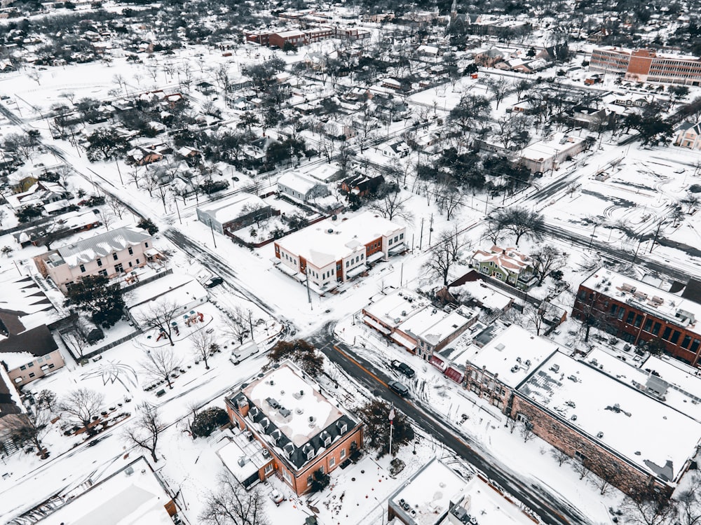an aerial view of a snow covered city