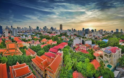 an aerial view of a city with tall buildings