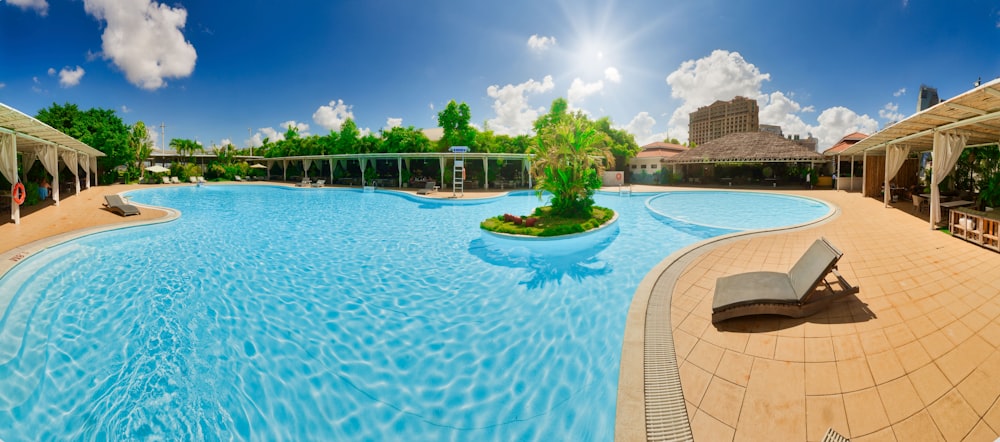 a large swimming pool with a bench in the middle of it