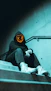 a person wearing a hoodie sitting on a set of stairs