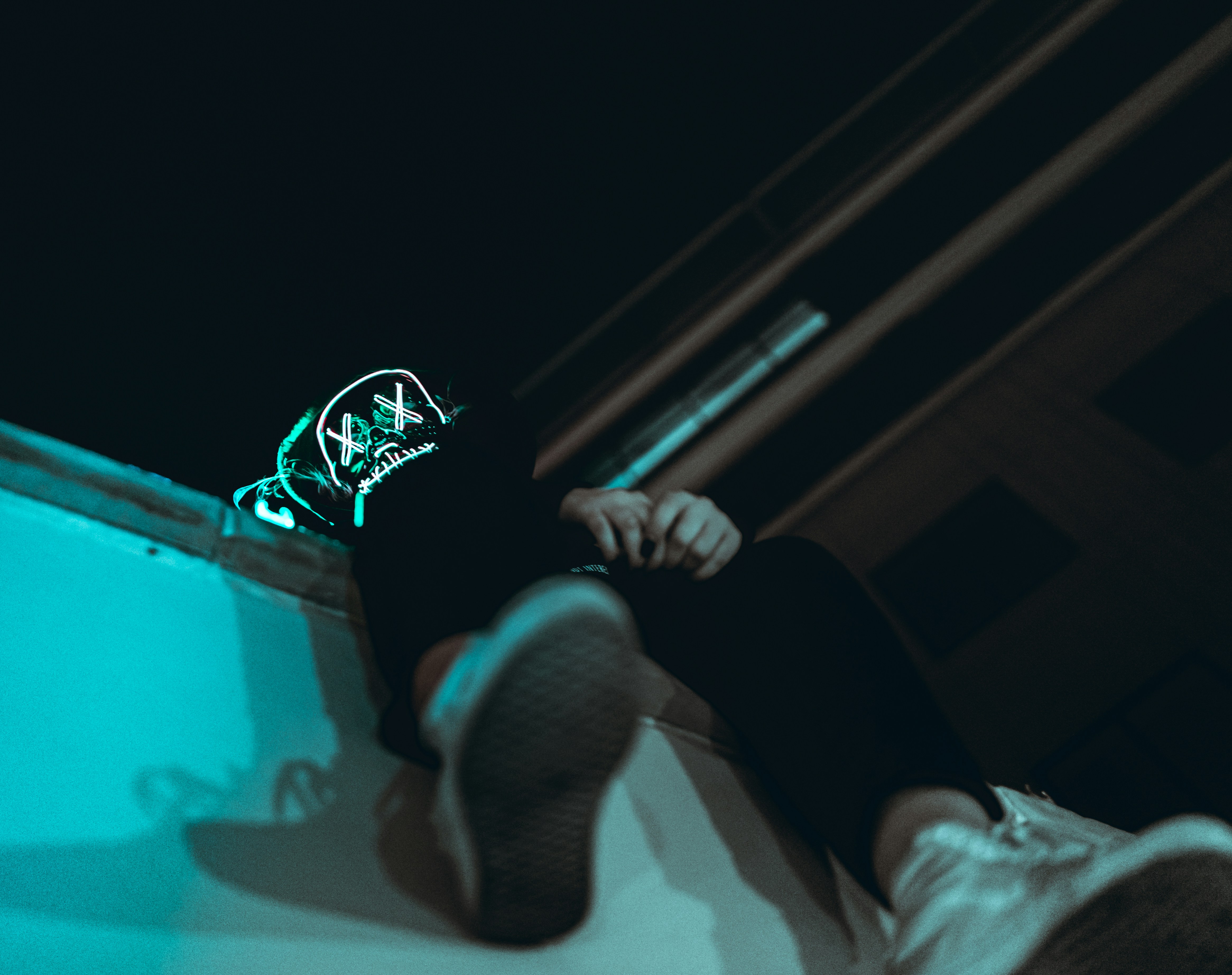 a person sitting on a ledge with their feet up