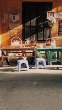 a group of chairs and a table in front of a building