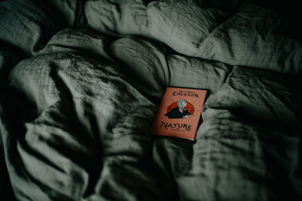 a book sitting on top of a bed