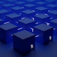 a group of blue cubes with numbers on them