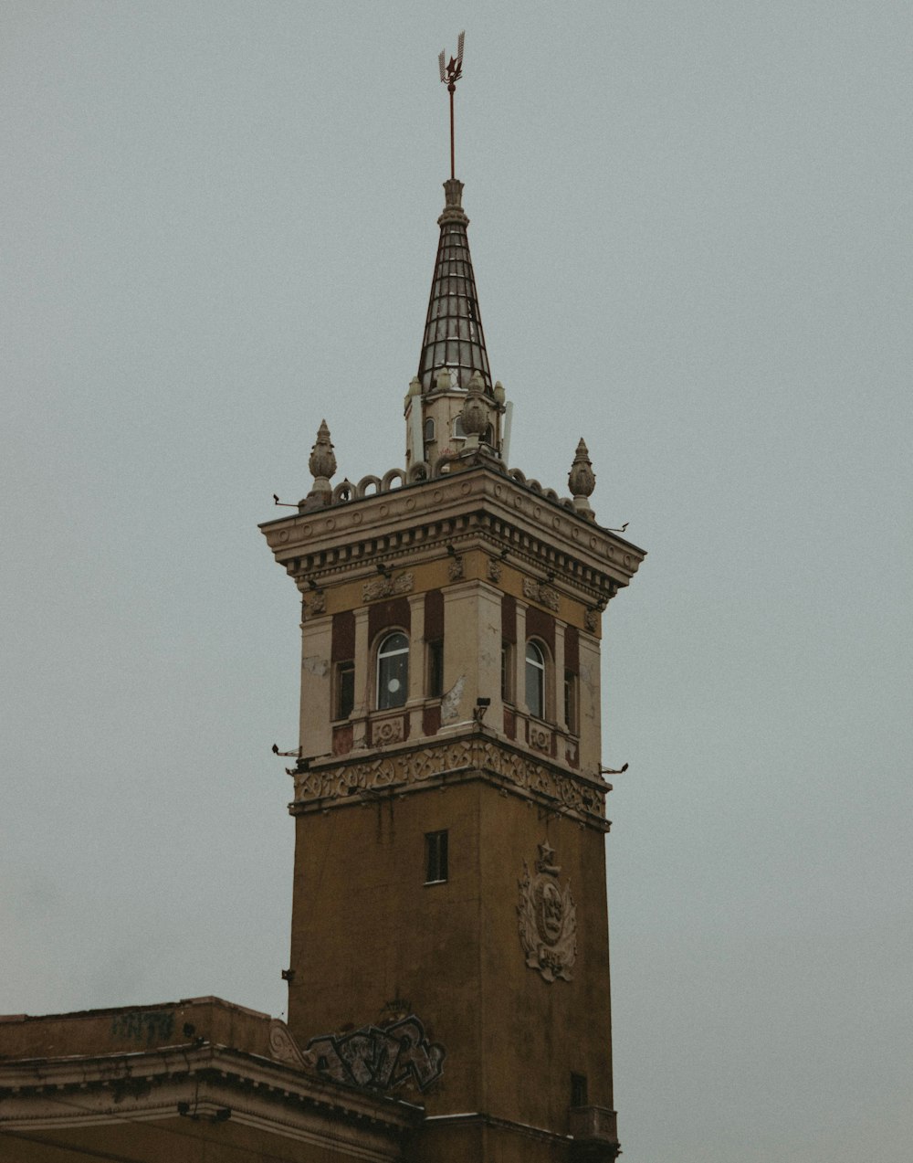 a tall tower with a clock on the top of it