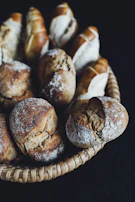 Freshly baked continental bread basket with a variety of rolls and croissants.