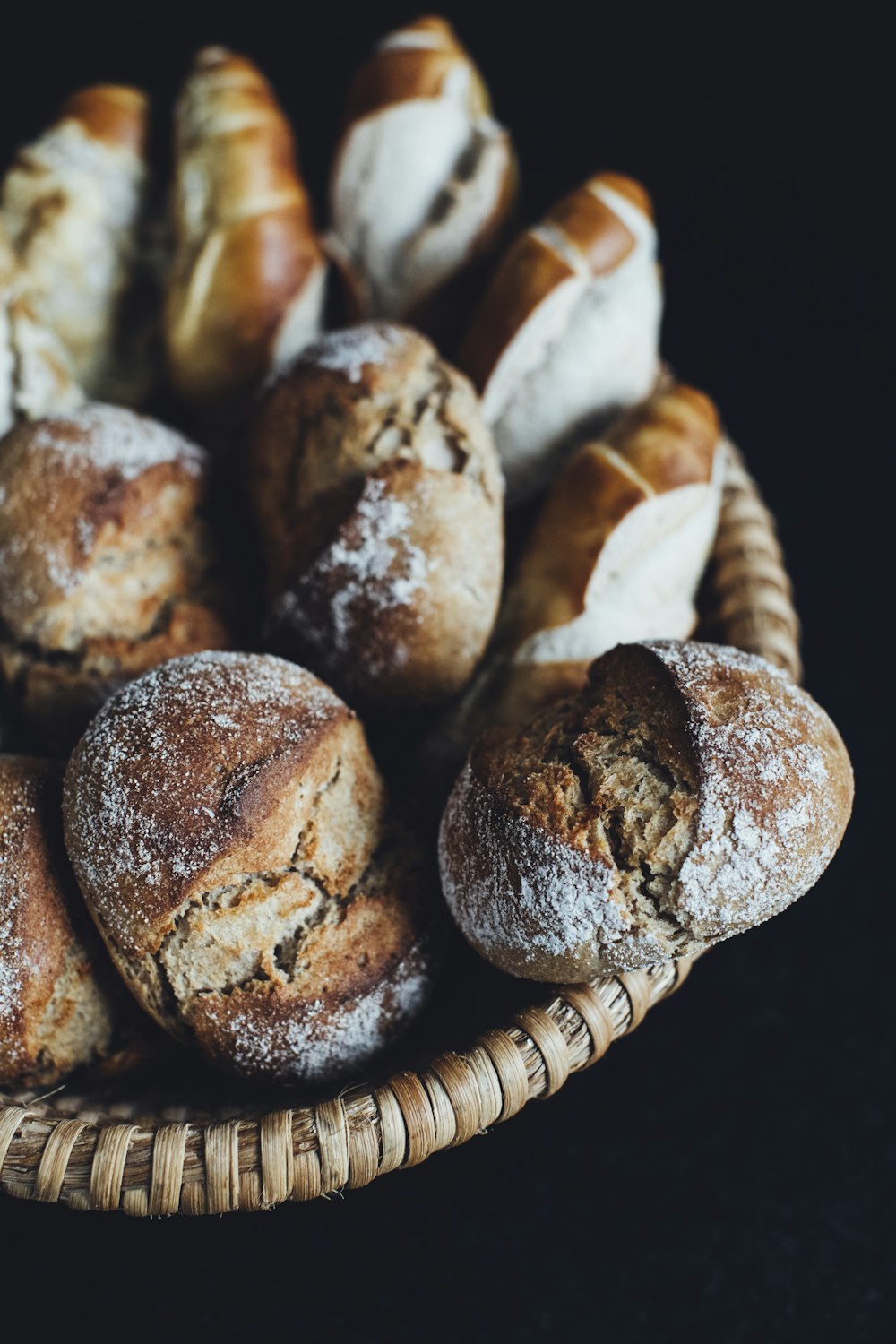 a basket filled with lots of different types of bread