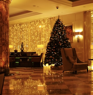 a christmas tree in the middle of a hotel lobby