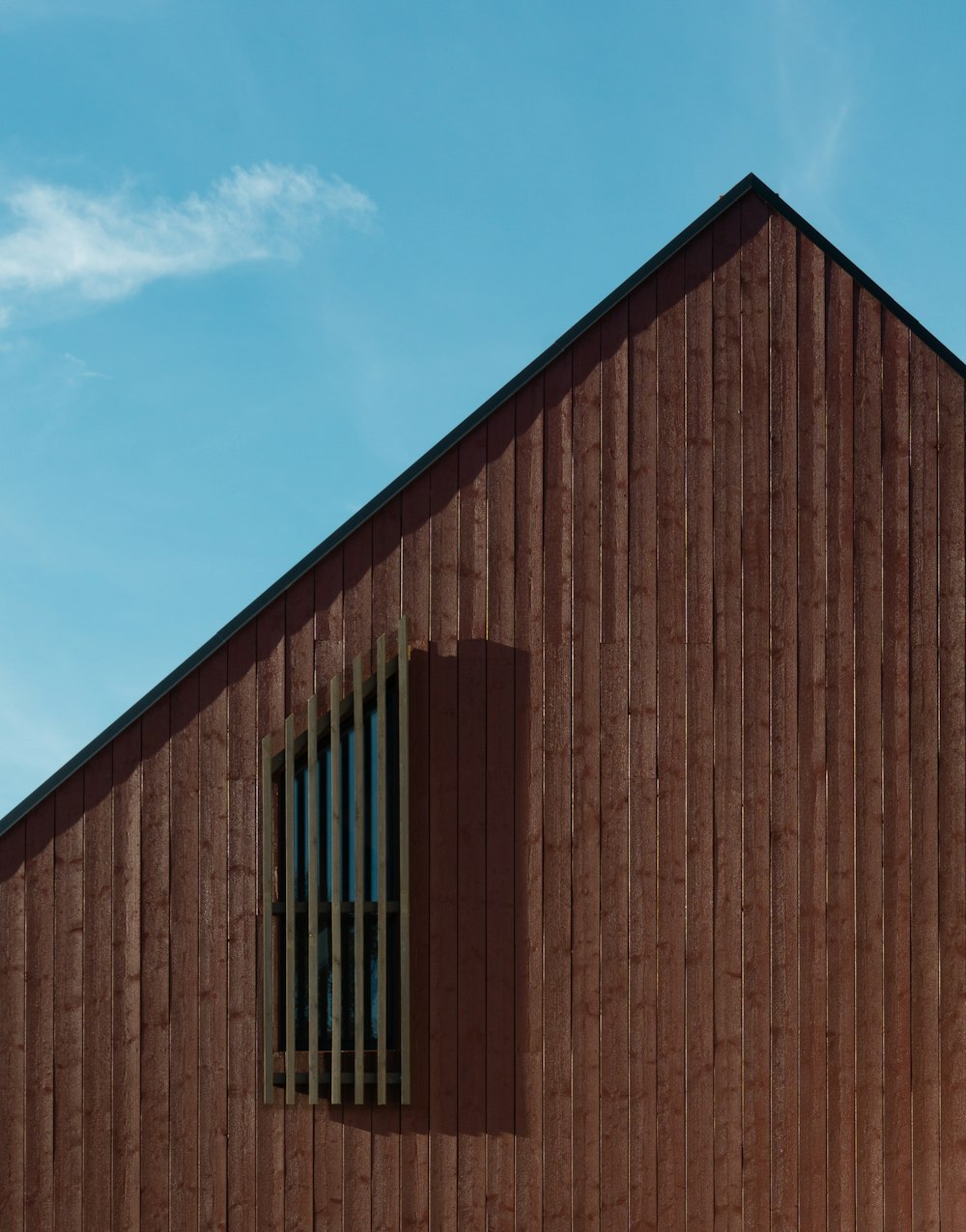 a wooden building with a window on the side of it