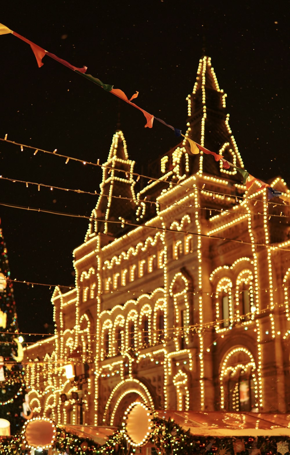 a large building with christmas lights all around it