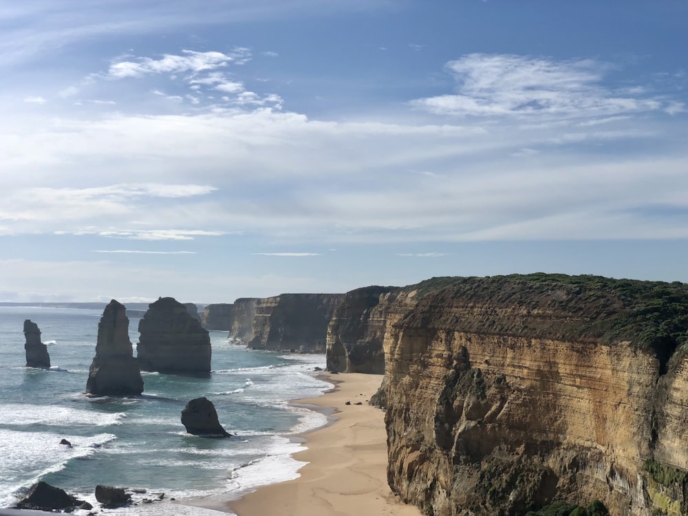 a view of the ocean and cliffs from a cliff