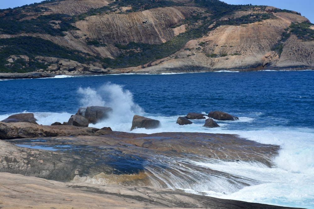 a large body of water surrounded by rocks