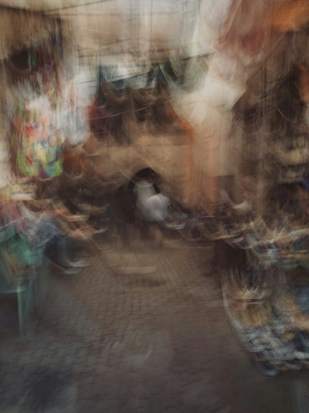 a blurry photo of a street with a lot of shoes
