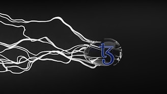 A black, spherical object with a blue 'tezos' logo is surrounded by swirling white lines that appear to be emanating from it, set against a dark background.