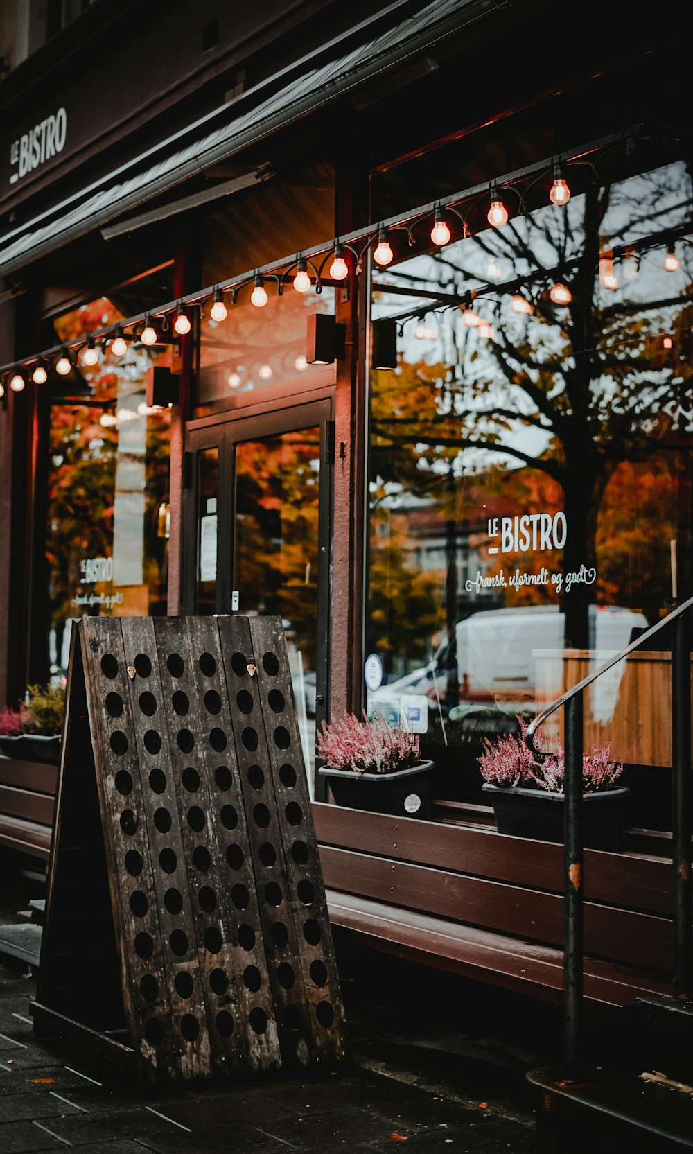 a wooden crate sitting outside of a store front