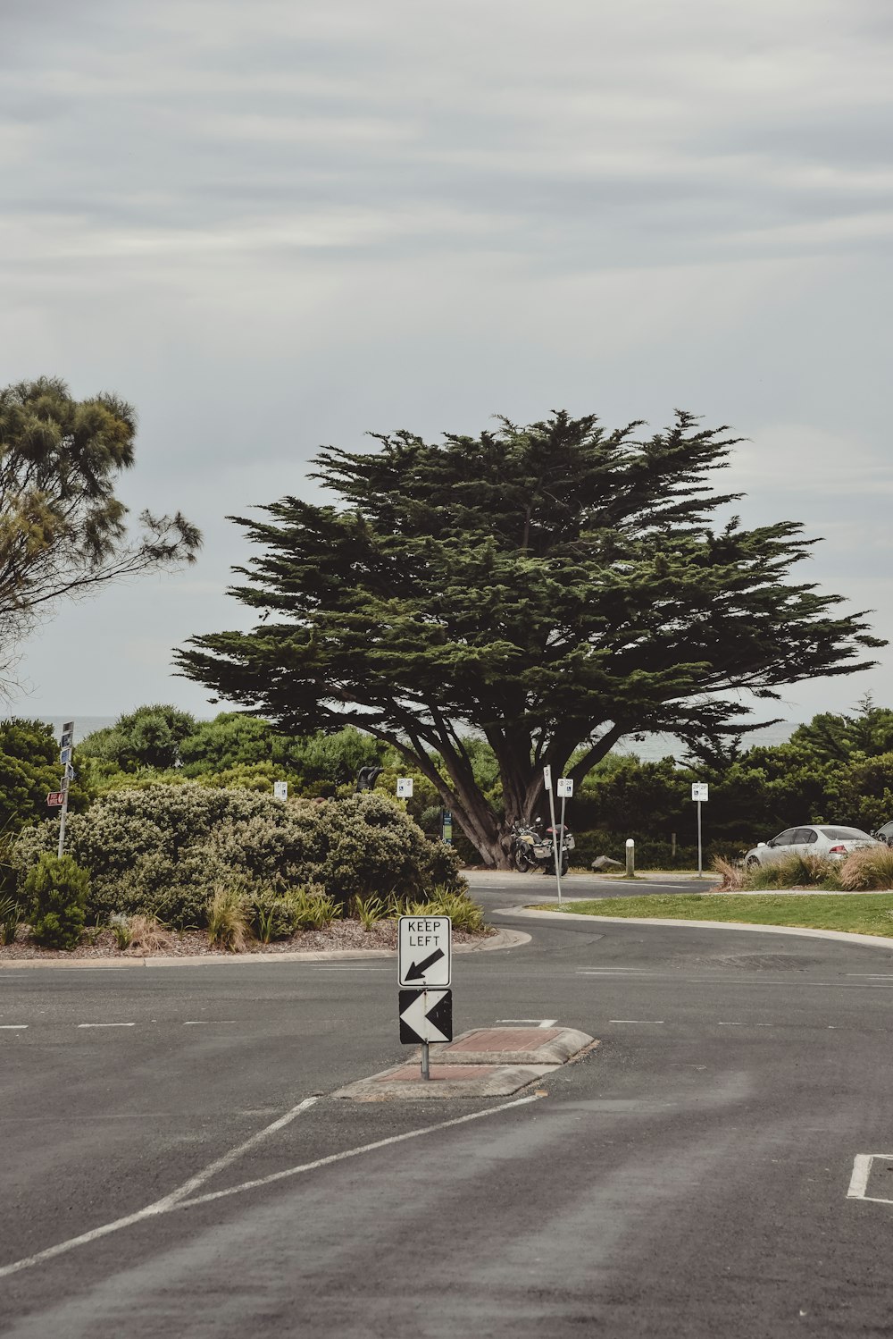 a person riding a motorcycle on the side of a road