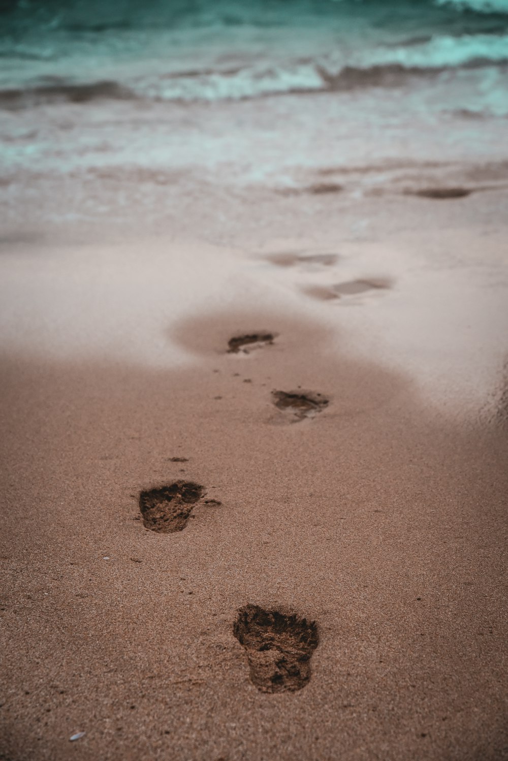 a couple of footprints that are in the sand