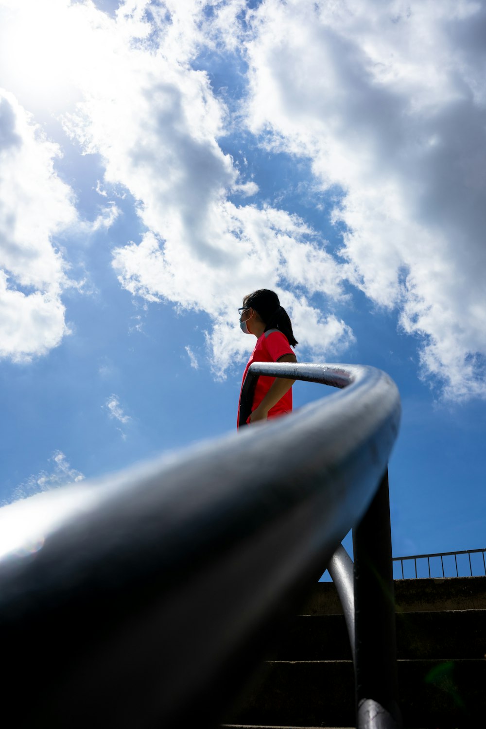 a woman walking up a flight of stairs