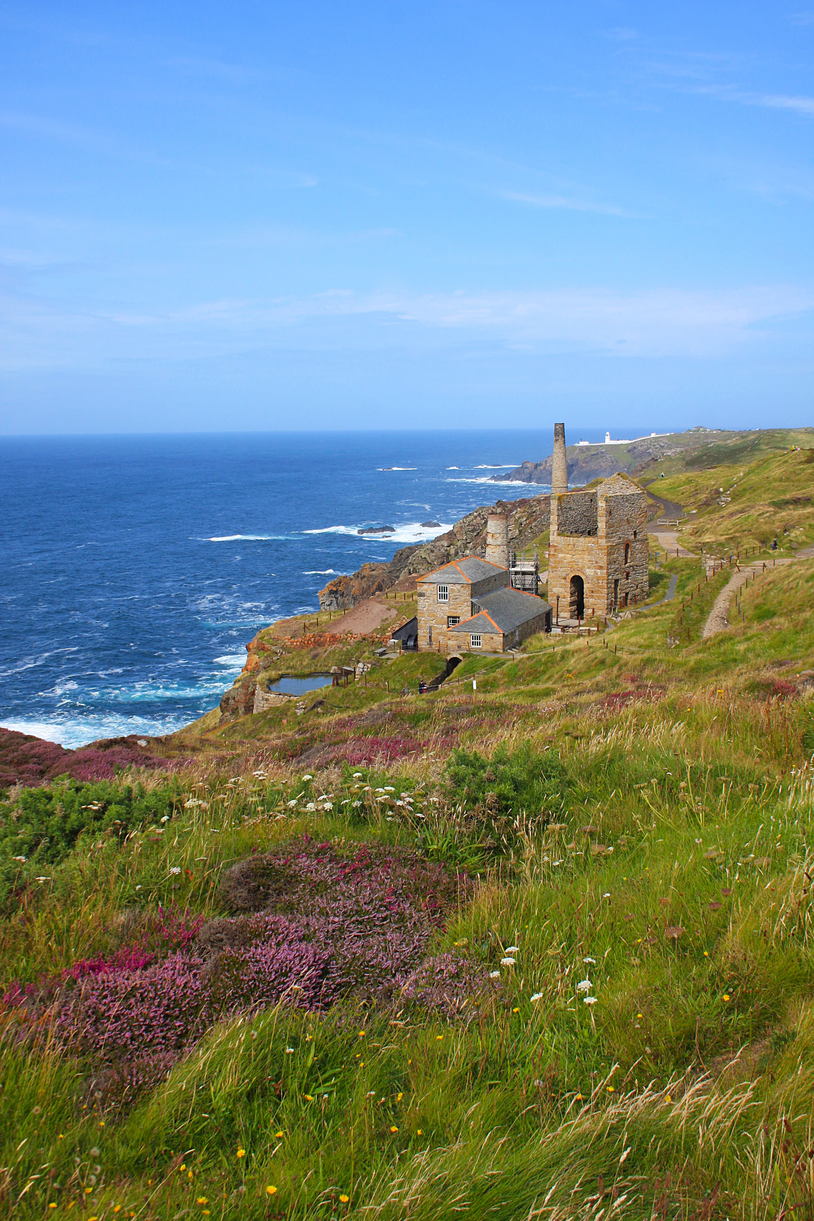A ruined tin-mine engine house on the cliffs of the Cornish coast.
