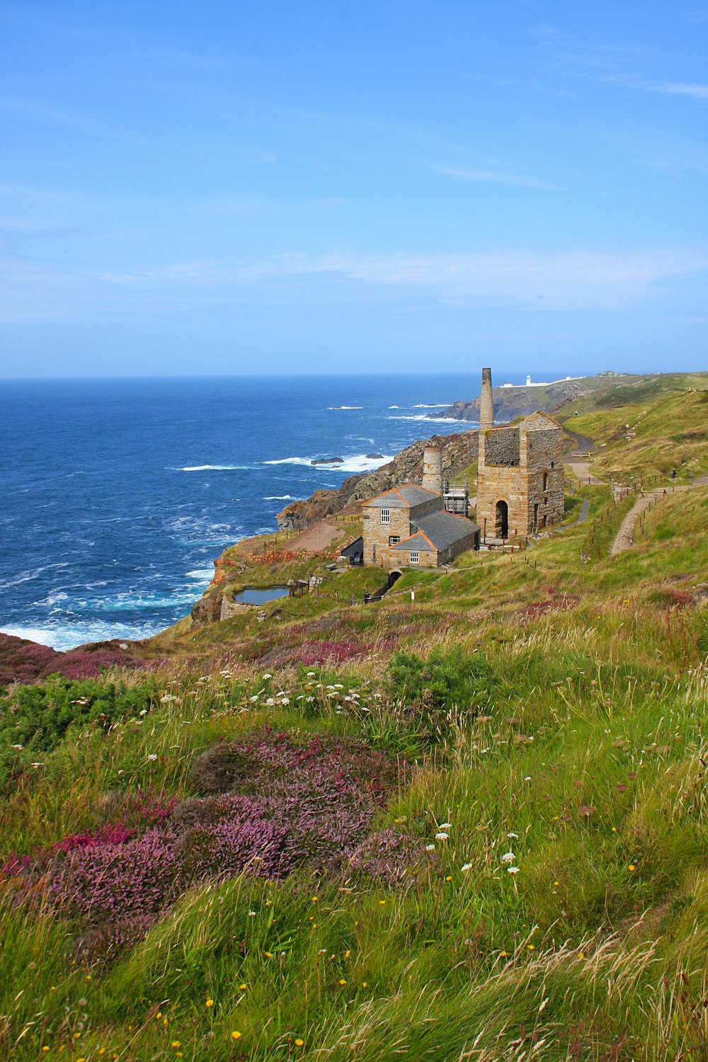 a grassy hill with a building on top of it