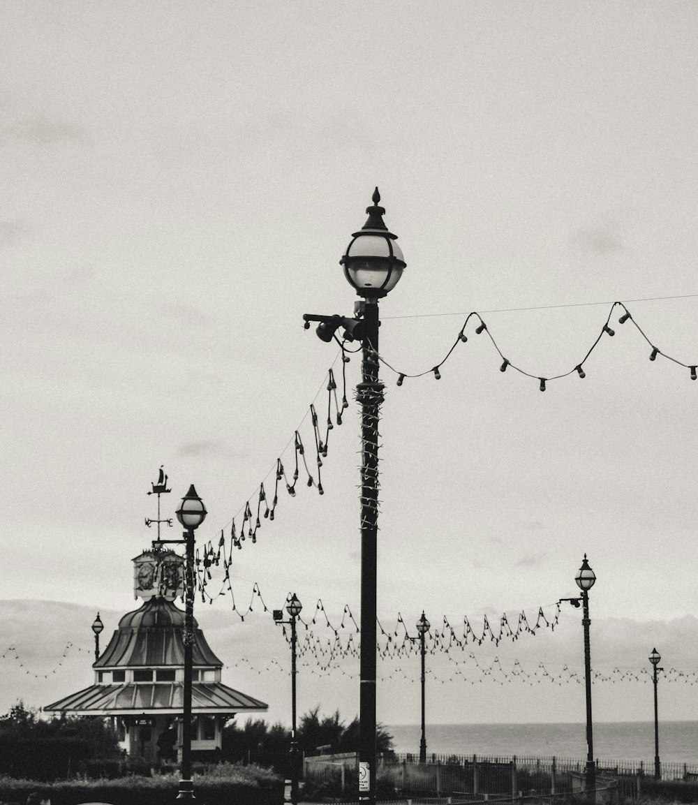 a black and white photo of a street light