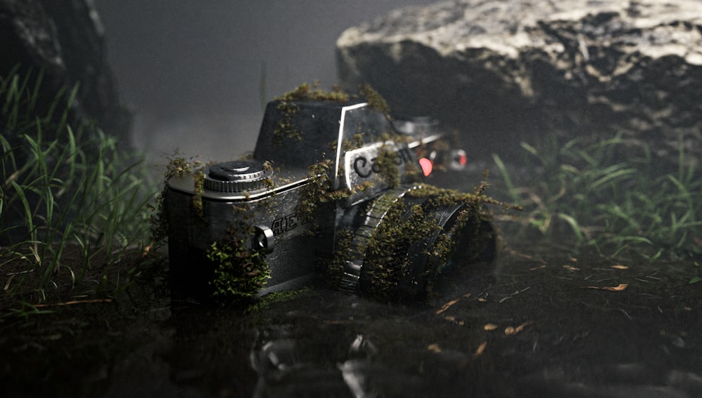 a camera sitting on top of a puddle of water