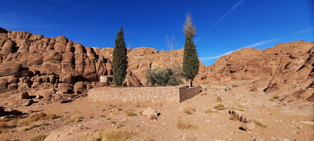 a stone wall in the middle of a desert