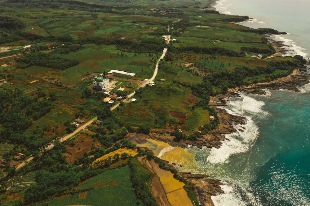 an aerial view of the ocean and land