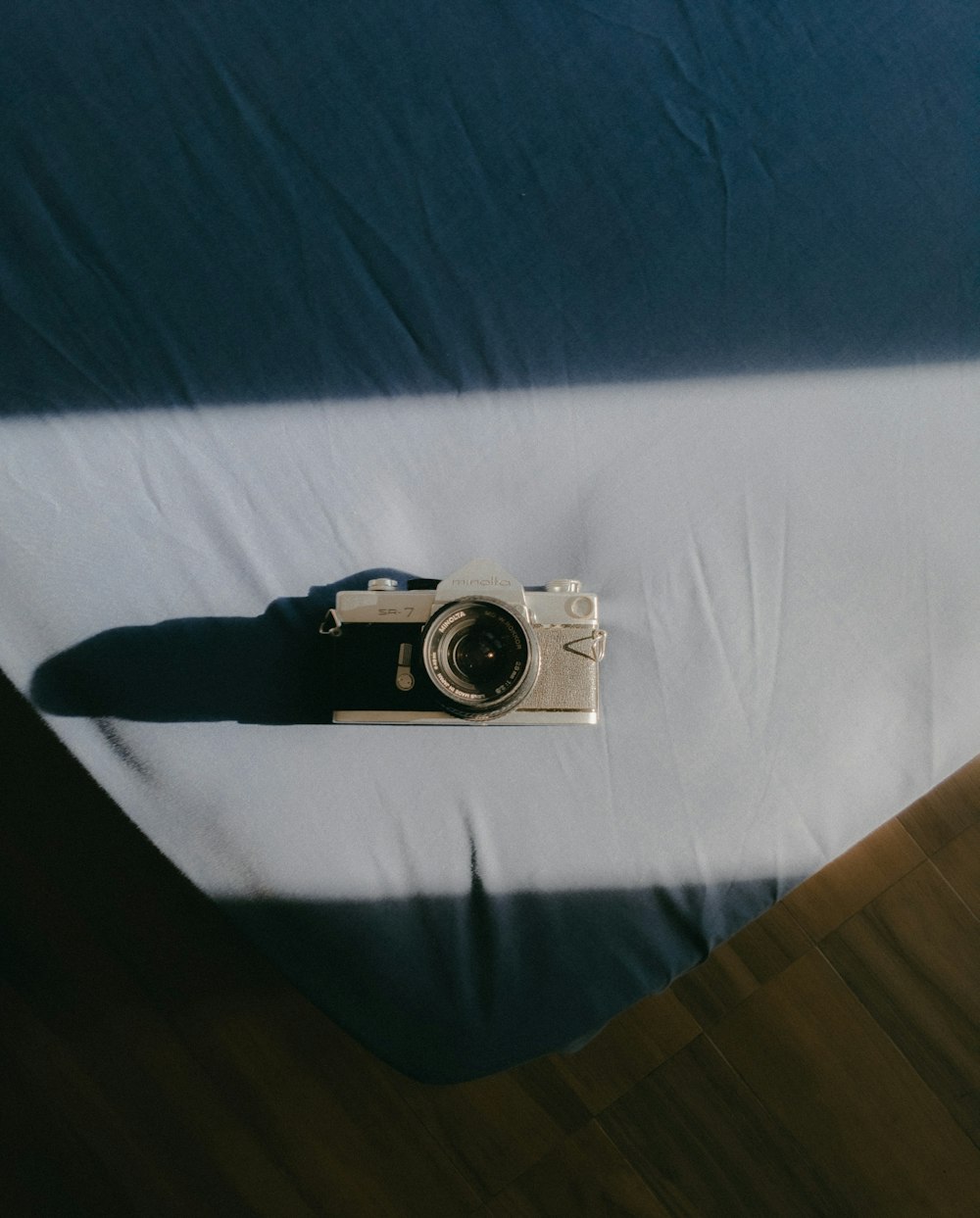 a camera sitting on top of a bed