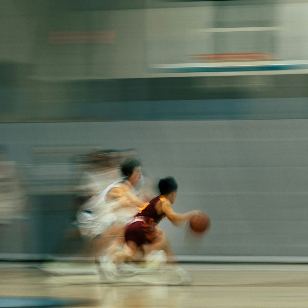 a group of people playing a game of basketball