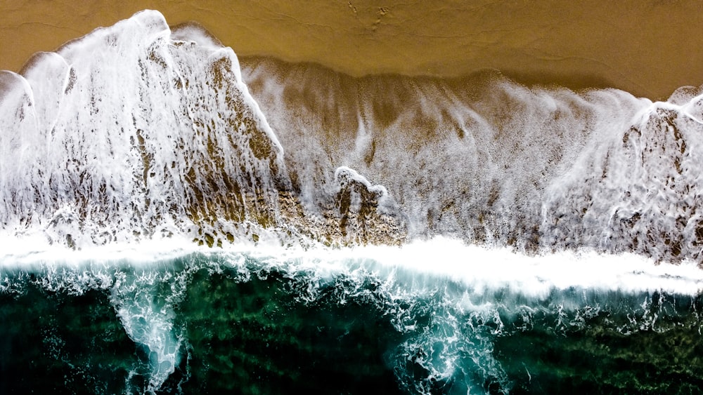 an aerial view of a mountain and a body of water