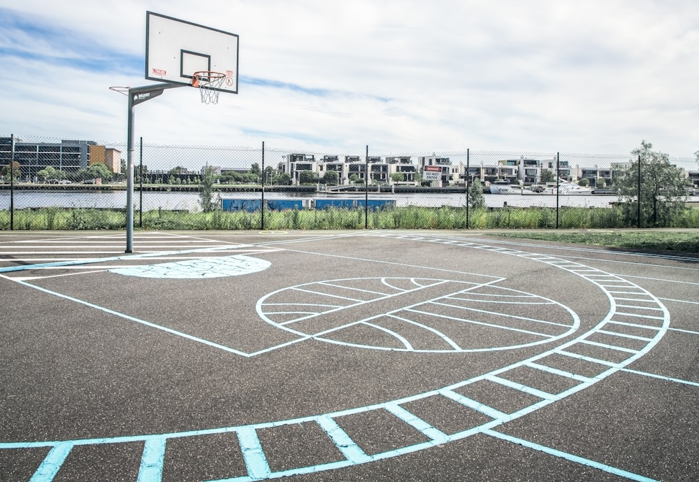 a basketball court with a basketball hoop in the middle of it