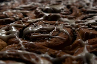 Close-up of freshly baked pastries displayed next to a cup of espresso.