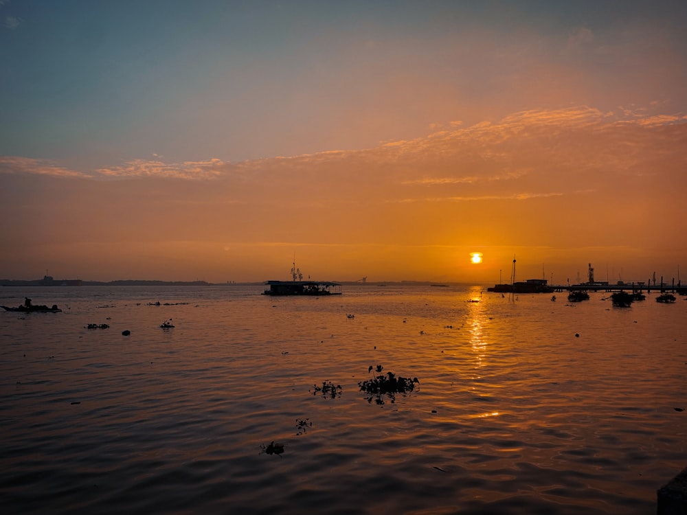 a large body of water with boats in the distance