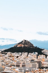 a view of a city with a mountain in the background