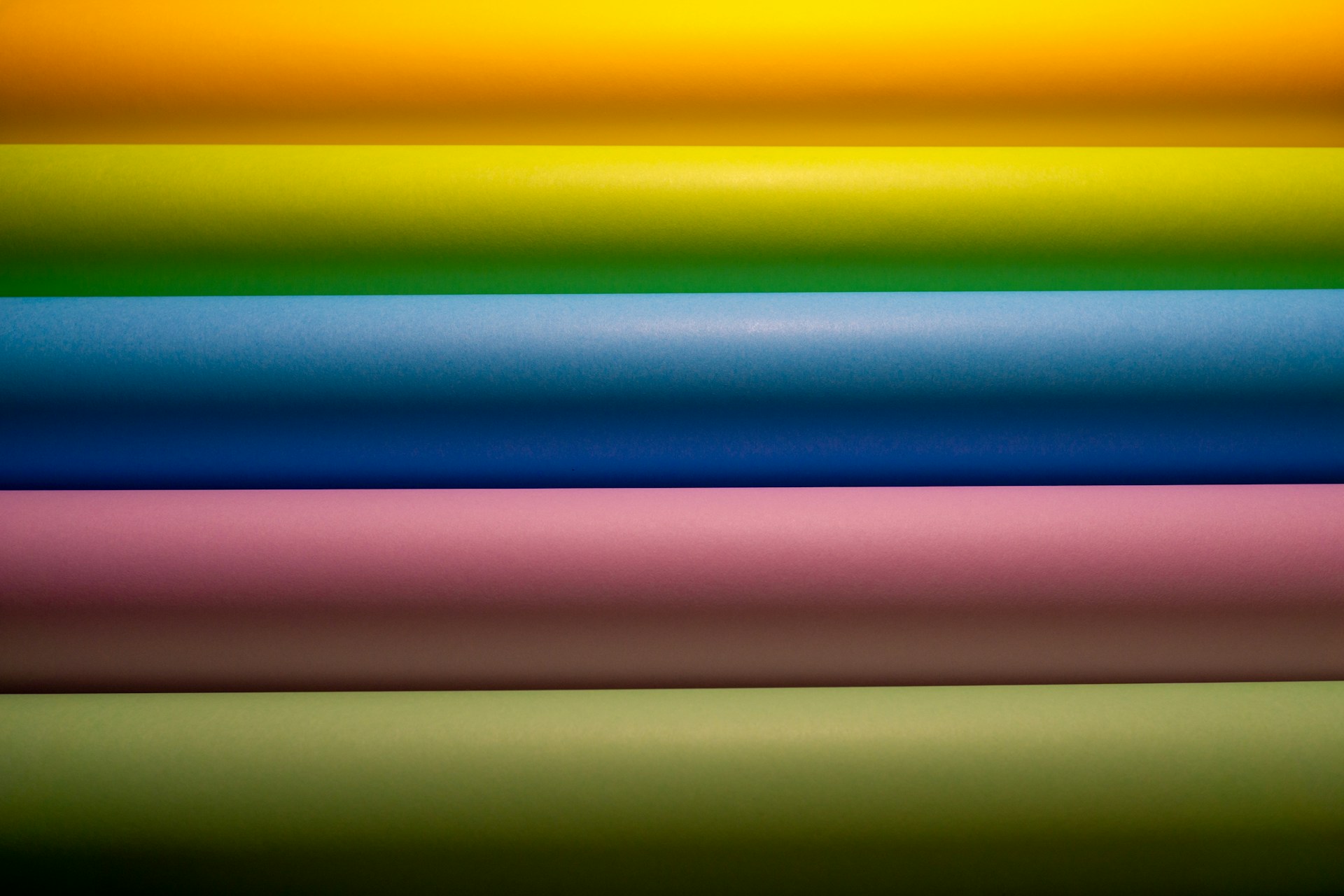 a group of different colored papers stacked on top of each other