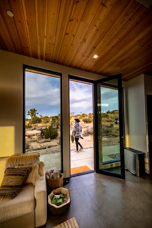 Living room with smooth-rolling sliding glass door after roller replacement