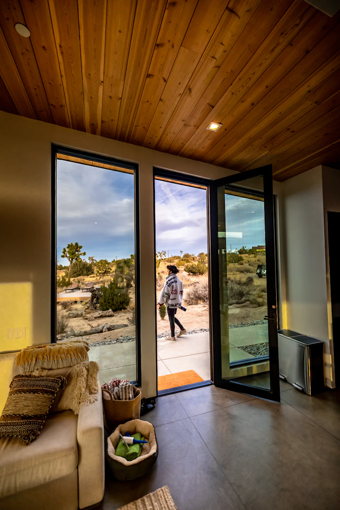 Modern living room with smooth-rolling sliding glass door after roller replacement