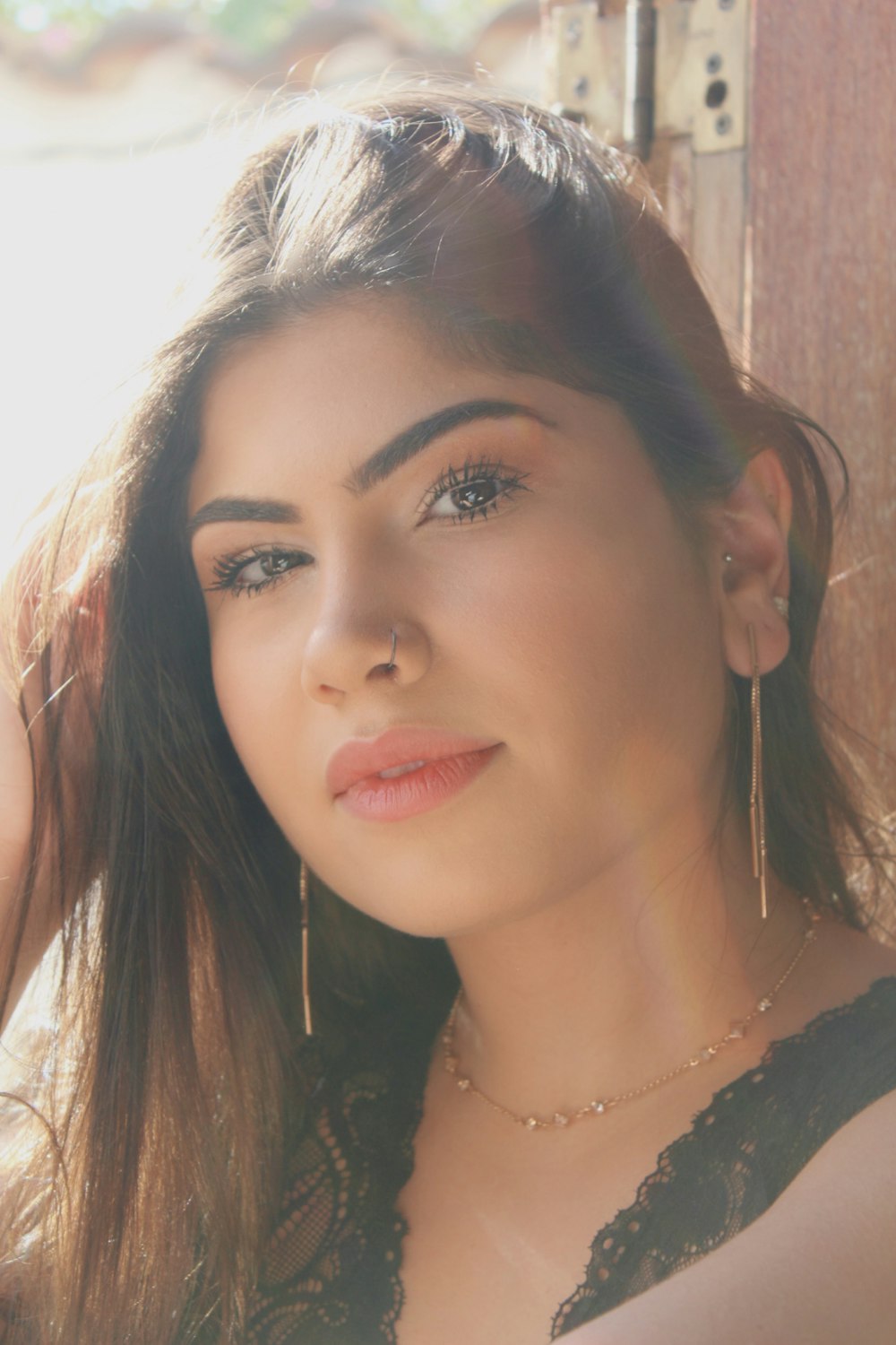 a close up of a person wearing a necklace