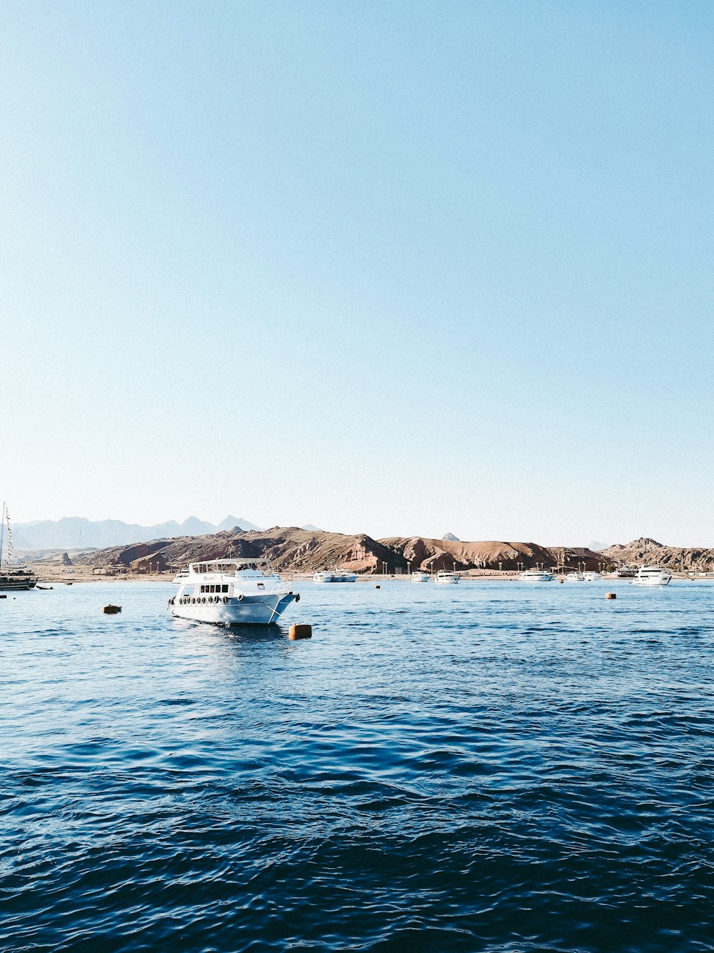 a boat floating on top of a large body of water