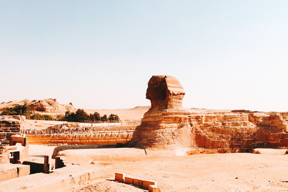 a large sphinx statue in the middle of a desert